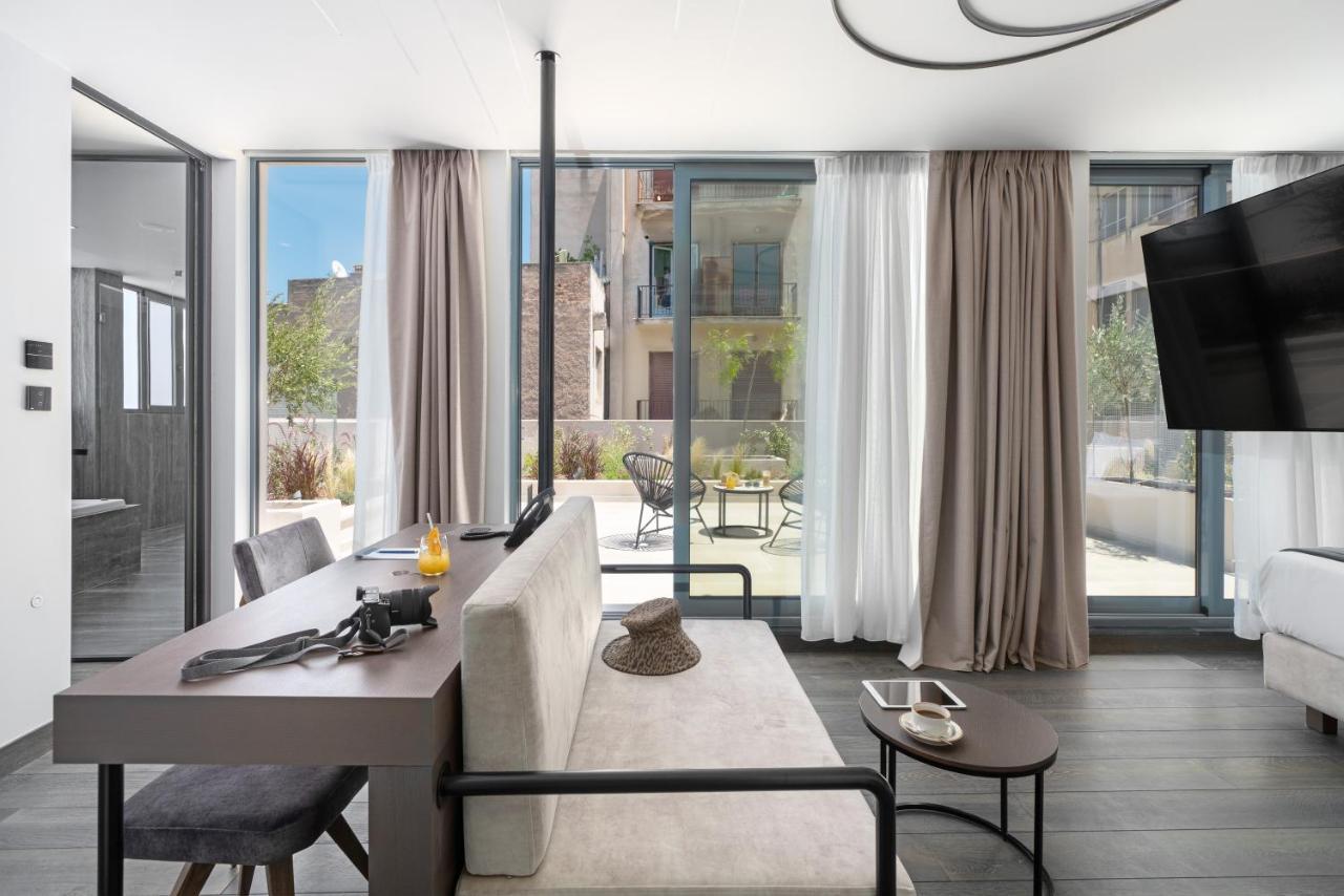 Hellenic Vibes Smart Hotel Aten Exteriör bild The interior of a suite at the hotel