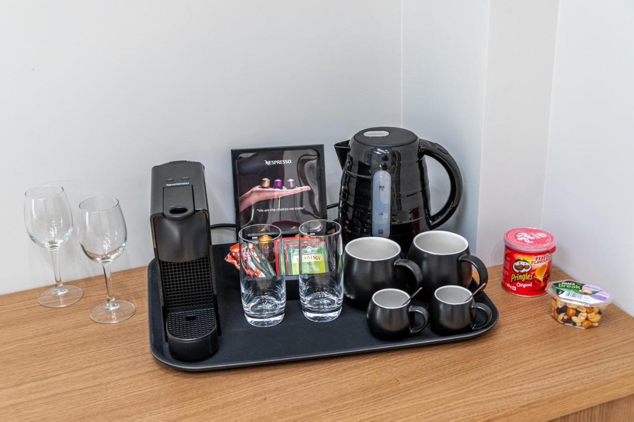 Hellenic Vibes Smart Hotel Aten Exteriör bild A Nespresso coffee machine in a hotel room